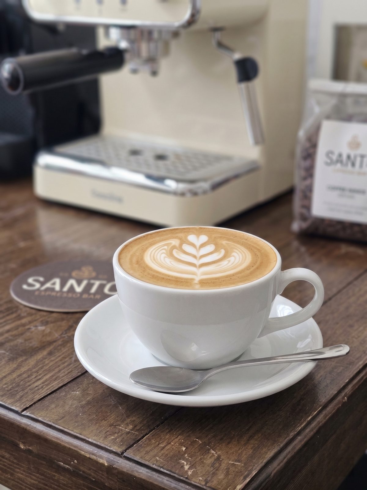 A latte with rosetta art at Santo Cafe